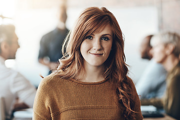 Image showing Business, portrait of businesswoman happy and meeting in office at work with coworkers in background. Entrepreneur or creative, lens flare and smiling female worker sitting at workplace in boardroom