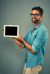 Image showing Happy man, tablet and mockup screen for advertising or marketing against a grey studio background. Portrait of male person smiling and showing technology display or copy space for advertisement