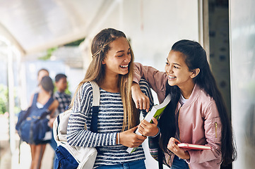 Image showing Girl friends, student and school with laughing and books with smile on campus. Teenager, young teen and girls with happiness and discussion together with education ready to start class and learning