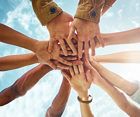 Image showing Bottom, people and hands in support of collaboration, trust or solidarity on blue sky background. Teamwork, friends and low angle hand of person group outdoor for team building, partnership or goal