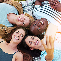 Image showing Friends, top view and outdoor for circle selfie, happiness and diversity for social media post, app or blog. Men, woman and youth for photography, profile picture and bonding while lying on ground