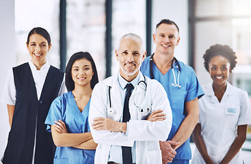 Image showing Teamwork, healthcare and portrait of doctors with nurses in hospital with arms crossed for leadership or support. Health, people and happy medical team with solidarity in collaboration at a clinic