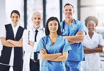 Image showing Team, healthcare and portrait of doctors with nurses in hospital with arms crossed for leadership or support. Diversity, smile and proud face of medical group in solidarity or service collaboration