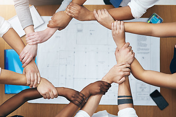 Image showing Hands together, above staff and blueprint of people with collaboration and architecture project. Architect team, diversity and paperwork of partnership and teamwork group from above with support