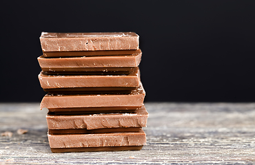 Image showing chocolate on a wooden table