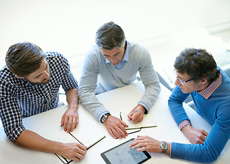 Image showing Planning, idea and tablet with business people in meeting for idea, strategy and teamwork from above. Review, collaboration and branding with employees in boardroom for digital, data and solution