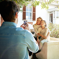 Image showing Happy family house, outdoor hug and phone photo of Mothers Day kid, child or girl with mom, mama or woman. Dad, bond and people enjoy quality time together in backyard garden, embrace and smile