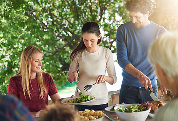 Image showing Food, salad and share with family at lunch in nature for health, bonding and celebration. Vacation, social and event with parents and children eating together for dining, generations and wellness