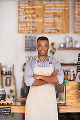 Image showing Black man, portrait smile and waiter with arms crossed in cafe with pride for owner career. Barista, happy and confidence of African person from Nigeria in restaurant, small business and coffee shop