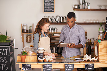 Image showing Tablet, restaurant and owner in teamwork of people, discussion and manage orders in store. Waiters, black man and happy woman in cafe with technology for inventory, stock check and managing sales.