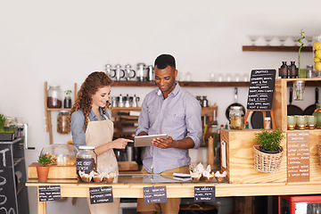 Image showing Restaurant owners, tablet and teamwork of people, manage orders and discussion in store. Waiters, black man and happy woman in cafe with technology for inventory, stock check and managing sales.