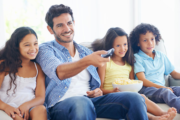 Image showing Happy family, relax father and children watching tv, subscription comedy movie or streaming home entertainment. Bonding, remote control and house kids, dad or people with popcorn and television show