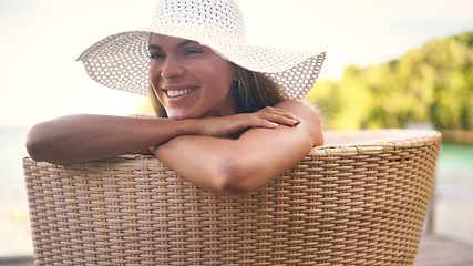 Image showing Summer, fashion and woman relax with hat for holiday, vacation and weekend getaway outdoors. Traveling, tropical resort and female person with smile for luxury tourism, sunshine and happy at poolside