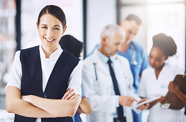 Image showing Healthcare, hospital and portrait of woman with arms crossed, smile and happiness with support in clinic. Health care, manager and medicine, confident and happy face of nurse or medical professional.