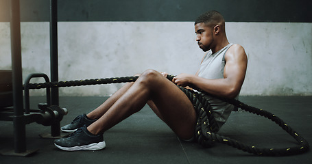 Image showing Health, fitness and man with weight sled at gym for training, power and intense cardio on wall background. Performance, endurance and male person with rope for strong, muscle or core workout on floor