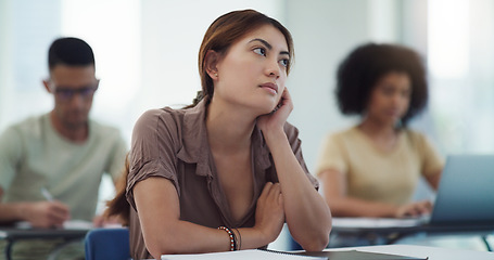 Image showing Education, depression and girl university student in a classroom bored, adhd or daydreaming during lecture. Thinking, anxiety and female learner distracted in class, contemplation, boredom or sad