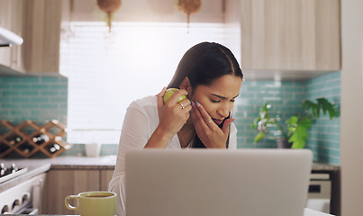 Image showing Tooth ache, bite injury and woman with apple and food at home working on a computer. Fruit, teeth pain and female person with dental accident in house with mouth issue and cavity problem while eating