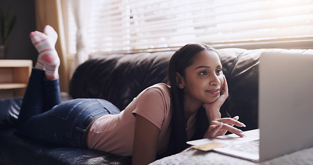 Image showing Laptop, search and woman relax on a sofa with streaming, entertainment and subscription in her home. Online, social media and female person on a couch on day off with film or reading in a living room