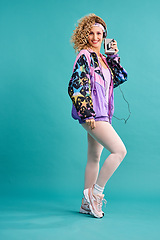 Image showing 80s fitness, retro and woman portrait with vintage, neon and style in a studio. Blue background, female person and cassette player of a model with workout, fashion and training outfit with a smile