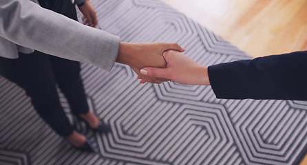 Image showing Handshake, business women and agreement to deal, partnership or b2b negotiation. Above professional people shaking hands for a client thank you, congratulations or hiring employee as HR partner