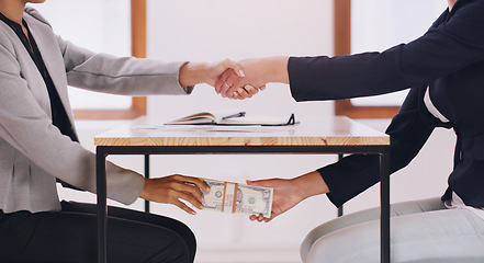 Image showing Hand shake, bribe under table and cash with business women with bad practice for deal, agreement and secret. Financial crime partnership, dirty money laundering and shaking hands with lawyer at desk