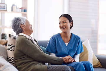 Image showing Consulting, caregiver and elderly woman laughing on sofa and holding hands in home living room. Support or healthcare, happy and female nurse talking or communication with senior citizen on a couch