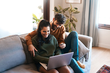 Image showing Laptop, credit card and happy couple on sofa, online shopping or cashback and spending in home. Smile, man and woman on couch to relax together, ecommerce or payment with bonding time and happiness.