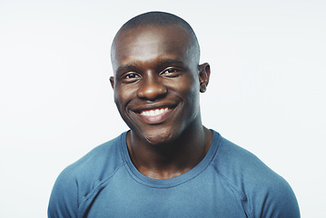 Image showing Black man, smile and portrait with happiness and confidence in a studio from Jamaica. White background, African male person and happy model face with pride, style and casual fashion with skin glow