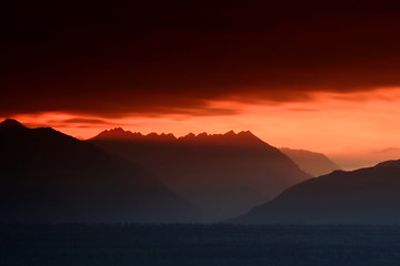 Image showing Cutting The Orange Sunset