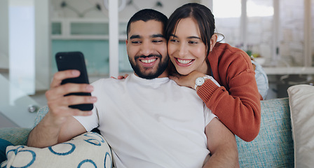 Image showing Phone, happy and couple with smile on sofa for social media post, online website and internet. Communication, relationship and man and woman relax on smartphone for quality time, bonding and network