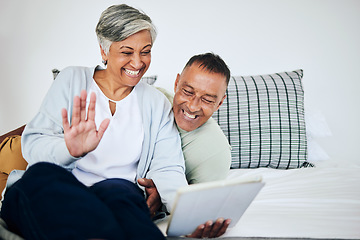 Image showing Digital tablet, video call and senior couple speaking, waving and bonding on a sofa in their house. Happy, smile and elderly man and woman in retirement on a virtual conversation with mobile at home.