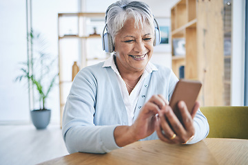 Image showing Senior woman, phone and music headphones with a smile while listening to audio, radio or podcast. Elderly female person in a house with a smartphone for streaming online, mobile app and relax