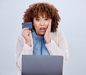 Image showing Credit card, laptop and a woman shocked or surprised with online shopping bill, scam or fintech payment. African female person with technology for e commerce mistake, security password or glitch