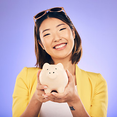 Image showing Piggy bank, saving and portrait of Asian woman in studio for investment, financial profit and budget. Finance, banking and face of happy female person with money container for savings, cash and coins