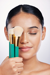 Image showing Brush for makeup, face and beauty with woman, foundation and powder isolated on studio background. Closeup of female model, natural cosmetics and skin glow with cosmetic tools and cosmetology