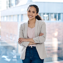 Image showing Happy, arms crossed and portrait of business woman in office for professional, corporate and confident. Smile, happiness and pride with female employee at window for mission as expert or entrepreneur