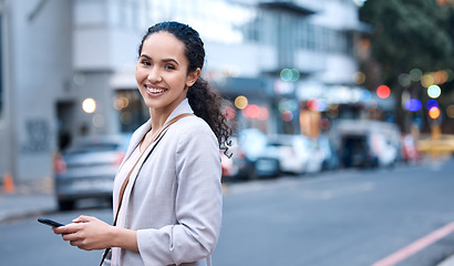 Image showing Happy, portrait and a woman in the city with a phone for communication, social media and a chat. Smile, internet and a young employee with a mobile in the street for a a gps, notification and typing