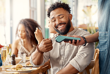 Image showing Ecommerce, credit card and man in a restaurant, machine and online payment with happiness, retail and social gathering. Male person, group and customer in a cafe, service and transaction for lunch