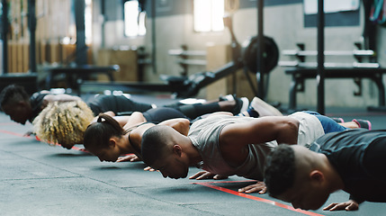 Image showing Fitness, sports club and people do push up in gym for training, exercise and workout class. Health, motivation and serious group of men and women body builders for challenge, wellness and strength