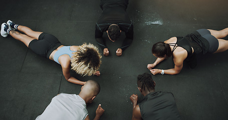 Image showing Top view, fitness and people do push up in circle in gym for training, exercise and workout class. Teamwork, body builder and men and women in sports club for challenge, wellness or strength on floor