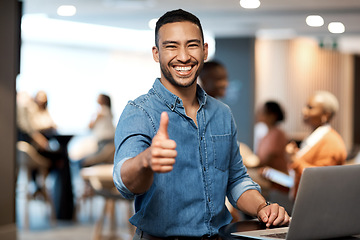 Image showing Portrait, business and man with a laptop, thumbs up and internet connection in a modern office, smile and agreement. Face, male person and employee with a pc, technology and professional with support
