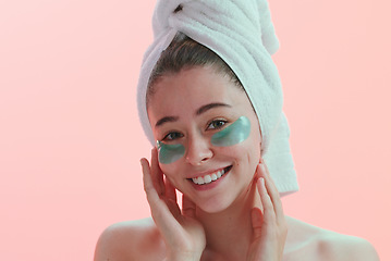 Image showing Portrait, skincare and woman with eye mask happy in studio for beauty, collagen and anti aging on pink background. Face, patches and female model with skin cosmetics, facial and hydration treatment