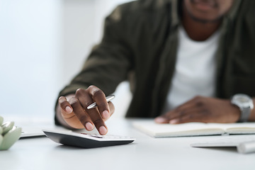 Image showing Hand, accountant with calculator and notebook planning at his desk at work. Finance or budget strategy, income and male entrepreneur or businessman working with money in office at his workplace