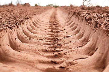 Image showing Sand, agriculture and field with land, farm and ground with economic growth, sustainability and nature. Earth, landscape and industry for farming, plough and dessert with climate change and drought