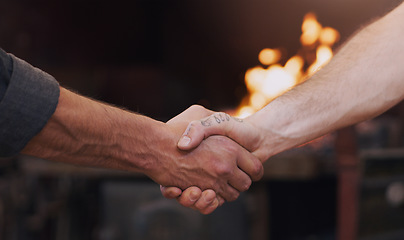 Image showing Handshake, meeting and thank you with men in a workshop together for a deal or agreement. Teamwork, welcome and partnership with male industry people shaking hands in a factory to gesture a greeting