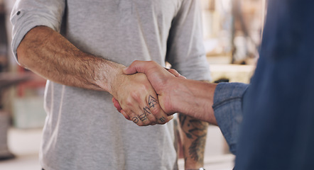 Image showing Handshake, welcome and partnership with men in a workshop together for a deal or agreement. Teamwork, meeting and greeting with male industry people shaking hands in a factory to gesture thank you