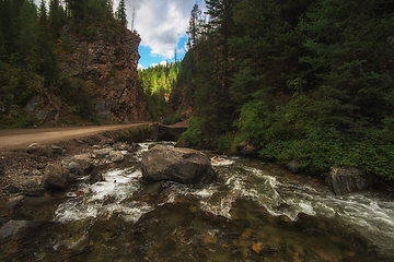 Image showing Mountain river, and road punched through the rocks