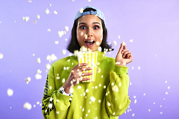 Image showing Popcorn, movie and woman surprise watching theatre or streaming service or cinema and in studio against a purple background. Video, entertainment and film or television or omg and snack on mock up