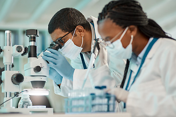 Image showing Covid, science and teamwork with people in a laboratory for research, innovation or vaccine development. Healthcare, medicine or microscope with a doctor and medical engineer working in collaboration