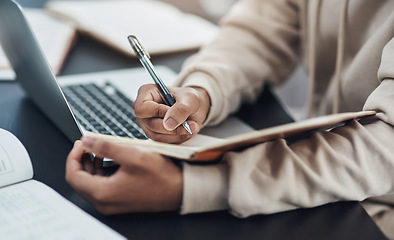 Image showing Closeup, hands and man writing in a notebook, remote work from home and planning with schedule, laptop or connection. Male person, freelancer or entrepreneur with a diary, journal or creative project